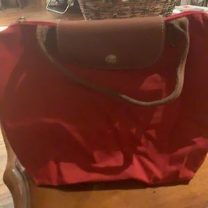 Red Longchamp Pliage small short handle bag